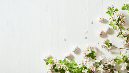 Holiday composition with spring flowers and easter eggs on a light background. Happy easter flat lay concept with copy spaceの写真素材