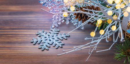 Christmas composition with white branches and Christmas decorations on a wooden table. Winter merry christmas holiday greeting cardの写真素材