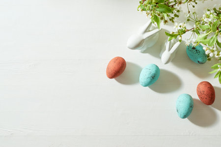 Holiday composition with spring flowers and easter eggs on a light background. Happy easter flat lay...