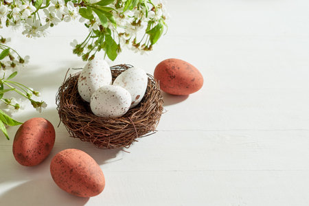 Holiday composition with spring flowers and easter eggs on a blue background. Happy easter concept...