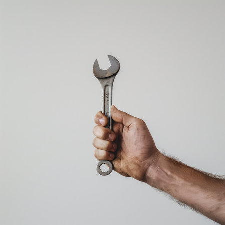 Hand holding a wrench, white background, AI generated Imageの素材