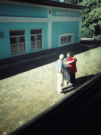 Couple in love standing on the terrace of an old houseの写真素材
