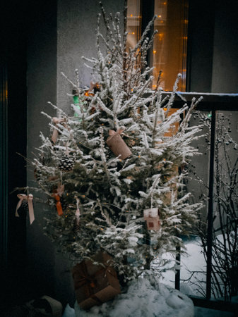 Christmas tree on the background of a window with gifts. New Yearの写真素材