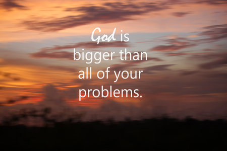God is bigger than all of your problems. Spiritual inspirational words concept with text message on blurry sunset sky with colorful clouds background. Believe in God concepts.の写真素材