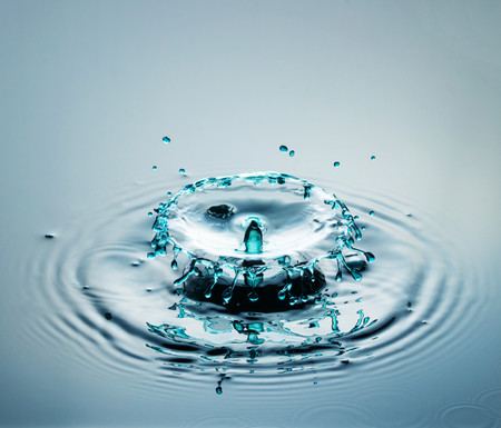 Water drop photography, one or two drops of water dropped from height into a tray filled with water...