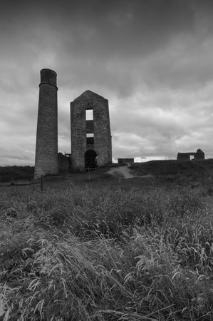 Some derelict buildings, including a chimney at a disused mine, Magpie Mine, in  the Peak Districtの写真素材