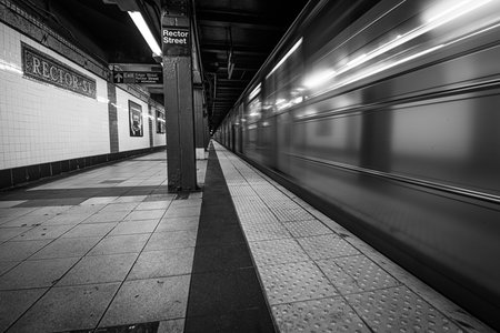 Subway Train Leaving Station at Rector Street, Manhattan in black and whiteの写真素材