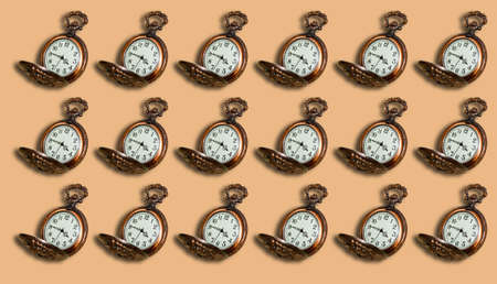 Pattern from an Old pocket watch on a beige background. Selective shot.