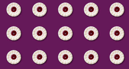 Pattern with a round cake on a cherry background. Prints, top View.