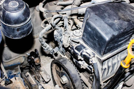 Dirty and dusty car engine close-up. Top view, selective shot.の写真素材