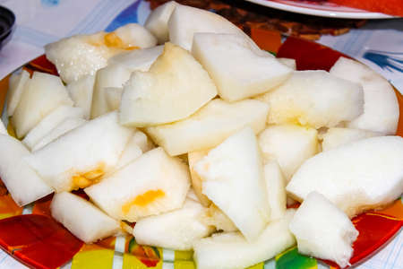 Ripe sliced melon torpedo on a plate. selective focus.の写真素材