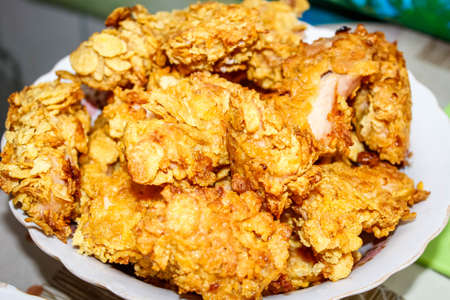 Fried pieces of chicken fillet in breadcrumbs, which are in the plate. Close up.の写真素材