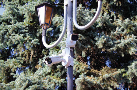 Chelyabinsk, Russia-July 05, 2020: a security camera is mounted on a pole In a Park. Selective focus.のeditorial素材