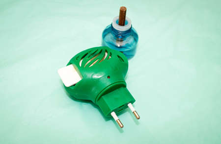 Home fumigator from mosquitoes in which a used plate is inserted and there is a liquid from insects...