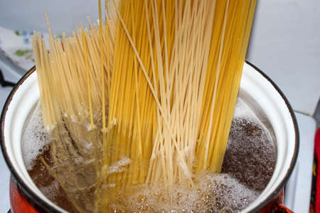 Different spaghetti in a pot of boiling water. Close-up, cookingの写真素材