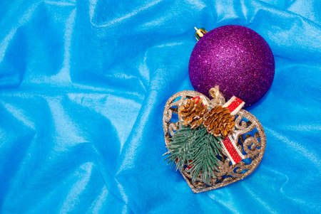 Christmas toys on the Christmas tree, balloon and heart, on a blue background. The view from the top.の写真素材