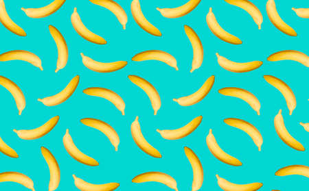 Pattern with whole bananas with a shadow on the turquoise surface as a decorative background. Fruit prints, templates.の写真素材