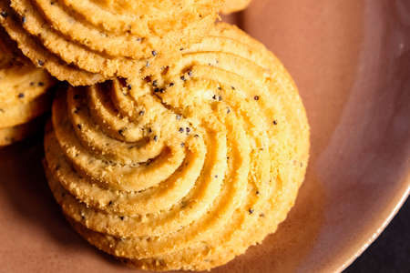 Delicious shortbread cookies with poppy seeds close-up. Top view, selective shot.