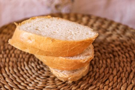 Cut pieces of baguette lie on top of each other. Close up.の写真素材