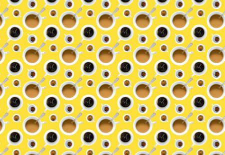 A pattern with different coffee mugs on a yellow background. Top view. Prints, patterns, copy space.の写真素材