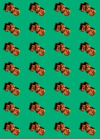 A pattern with a sliced energy bar on a green background. Sports nutrition. Prints, templates.