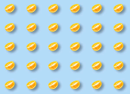 A pattern with slices of fresh orange on a blue background. Prints, templates.