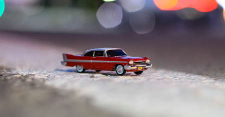 CHELYABINSK, RUSSIA-AUGUST 26, 2021: A red toy model of the car Christina Plymouth Fury on the...