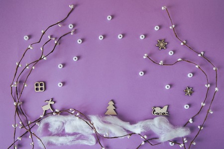 Background with Christmas decorations. View from above. Composition on lilac background with branches, snowflakes and other elementsの写真素材