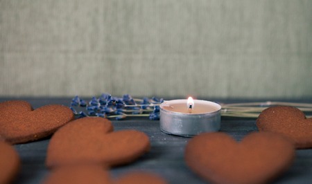 Heart gingerbread cookies with candle. Concept the Feast Day of Holiday Valentine's Day. Selective focus, copy space for textの写真素材
