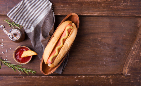 Fast food, hot dog with yellow mustard and french fries. Top viewの写真素材