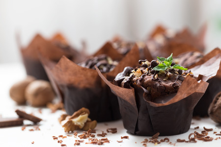 Chocolate muffins with walnut, homemade bakery, close up, selective focusの写真素材