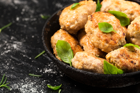 Homemade chicken cutlets in a pan.の写真素材