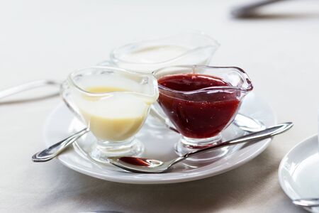 Various sweet sauces on a white plate, selective focusの写真素材