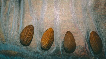 Almonds in wooden backgroundの写真素材