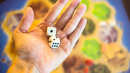 Russia / Saint-Petersburg -30.10.2019: The dice game: hand throwing game cubesのeditorial素材