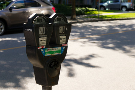 Vancouver, Canada - September 13, 2019: Parking meter on West Pender Street in Vancouver. Pay by phone available.のeditorial素材