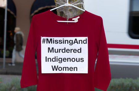 Vancouver, Canada - October 5, 2019: A red dress with text Missing And Murdered Indigenous Women is...