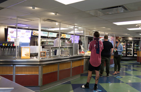 Vancouver, Canada - July 16, 2020: Passengers with face masks on are lining up to buy food on BC...