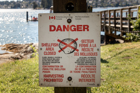 Belcarra, Canada - July 13,2020: View of sign Shellfish area closed, harvesting prohibited in...