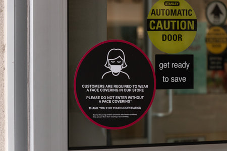 Courtenay, Vancouver Island, Canada - November 21,2020: View of sign Mask Required at the entrance of Winners Store due to COVID-19 Preventionのeditorial素材
