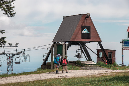 North Vancouver, Canada - July 6,2020: Two little boys walking near  the older double chairlifts at Seymour Mountainのeditorial素材