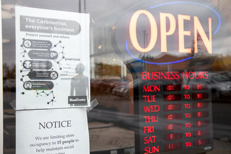 Courtenay, Vancouver Island, Canada - November 21,2020: View of sign Coronavirus, everyone's business at the entrance of Sleep Country Store due to COVID-19 Preventionのeditorial素材