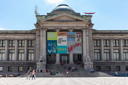 Vancouver, Canada - June 29,2020: Teenagers are sitting in front of Art Gallery in downtown...