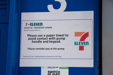 Vancouver, Canada - July 13,2020: Covid-19 update sign at  Esso Gas Station. Please avoid contact...