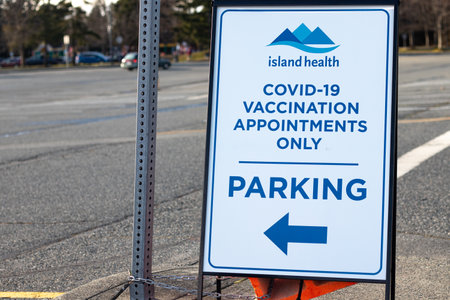 Nanaimo, Canada - March 7,2021: View of directional sign COVID-19 vaccination appointments only on a parking lot in Beban Parkのeditorial素材