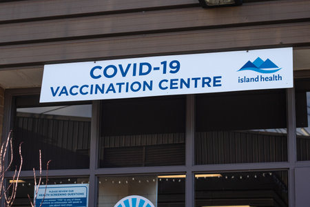 Nanaimo, Canada - March 7,2021: View of entrance building with sign Covid-19 Vaccination Centreのeditorial素材