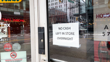 Vancouver, Canada - January 8,2022: View of sign No Cash Left in Store Overnight following an...