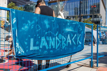 Vancouver, Canada - July 1,2022: View of sign Land Back as part of protest against celebration of Canada day in front of Vancouver Art Galleryのeditorial素材