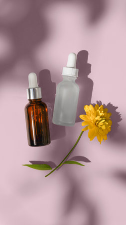 illustration of blank packgaing white and black glass dropper serum on a beige background with yellow flower. hard light. ready for design yours mockupの写真素材