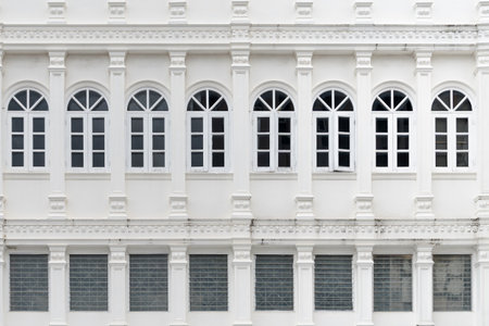 close-up shot of a white building with columns and windows